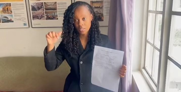 Lutho explaining how approved building plans are collected from the municipality