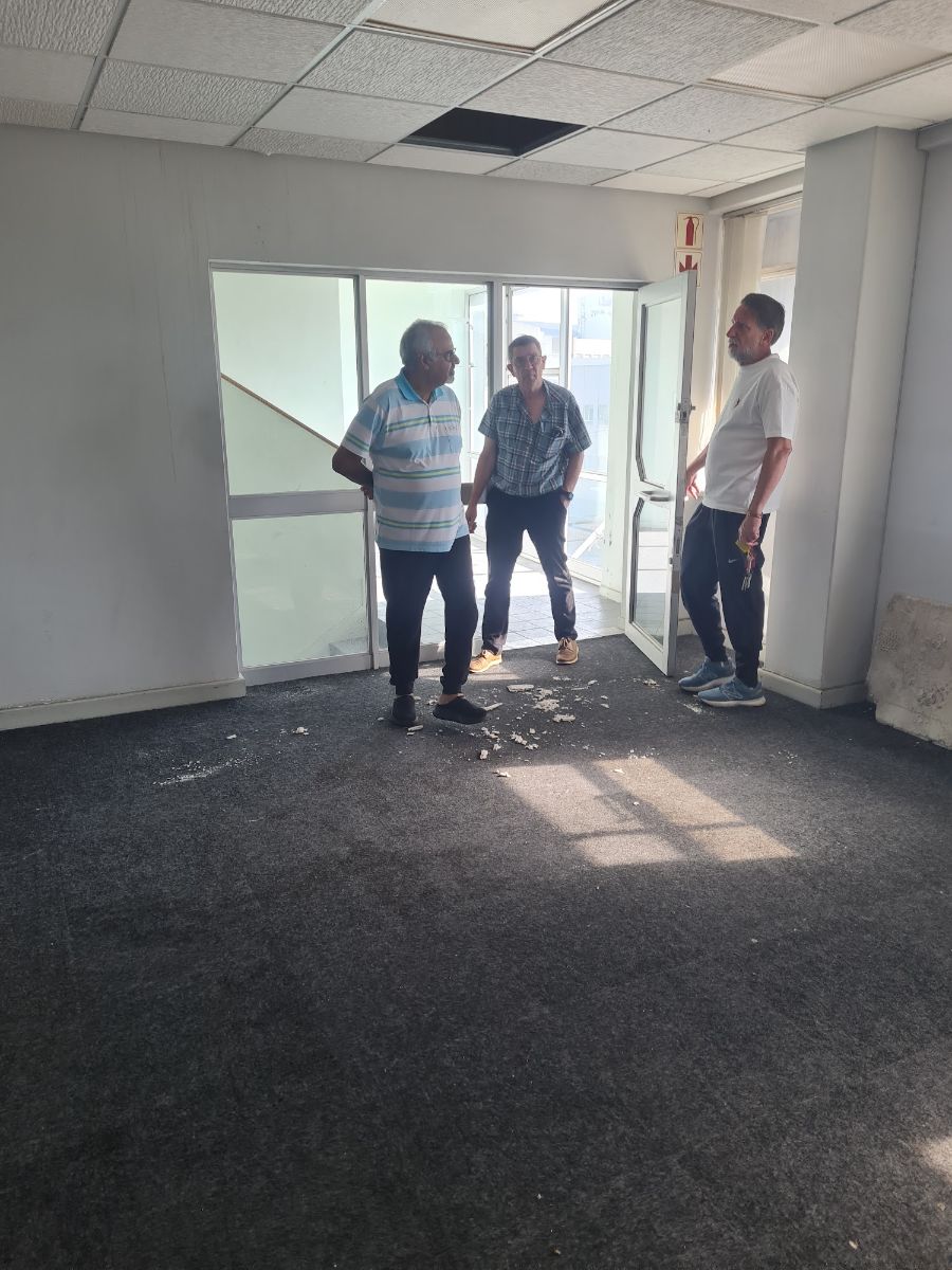 A site meeting in a stripped-out space, working out what it could become